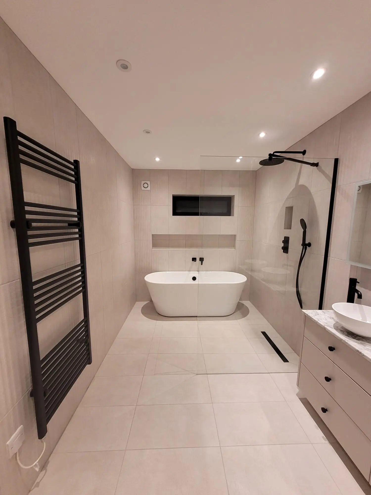 Bathroom with freestanding bath and double basin