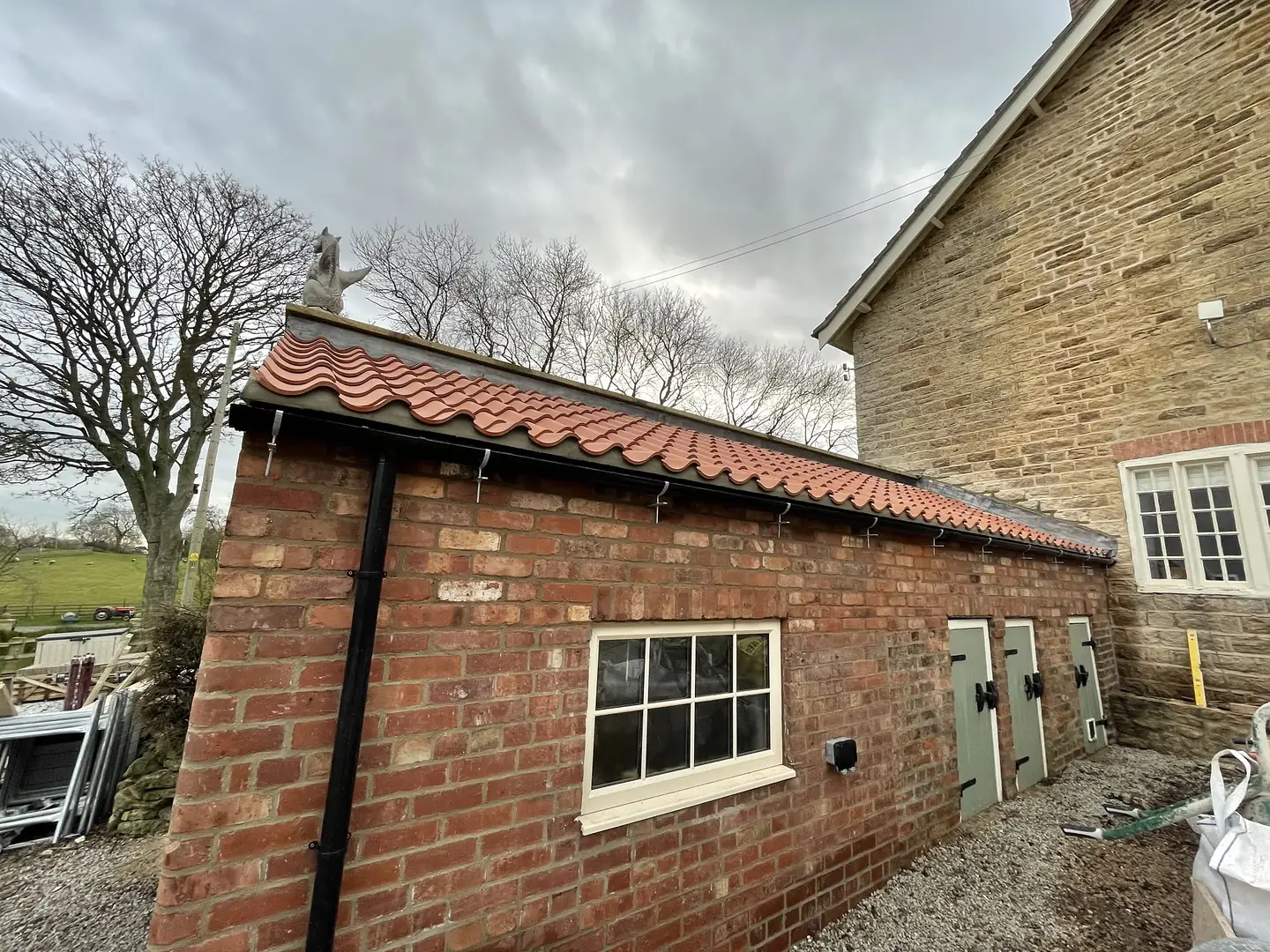 Brick outbuilding with pantile roof