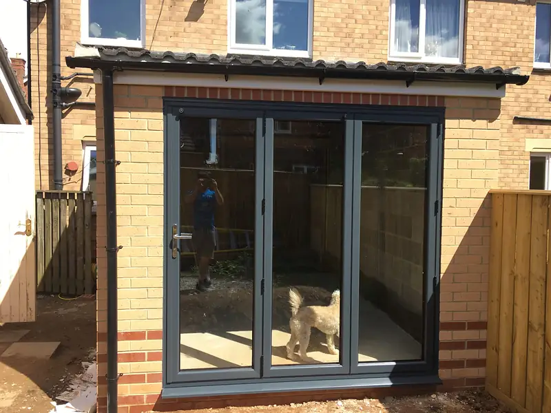 Brick rear extension with bifold doors on a narrow plot