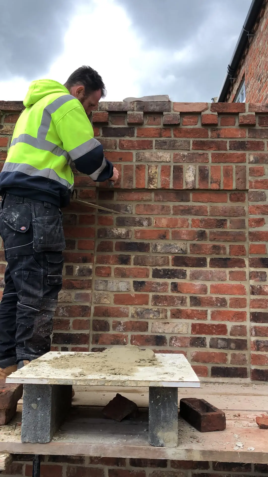Bricklayer building a garden wall