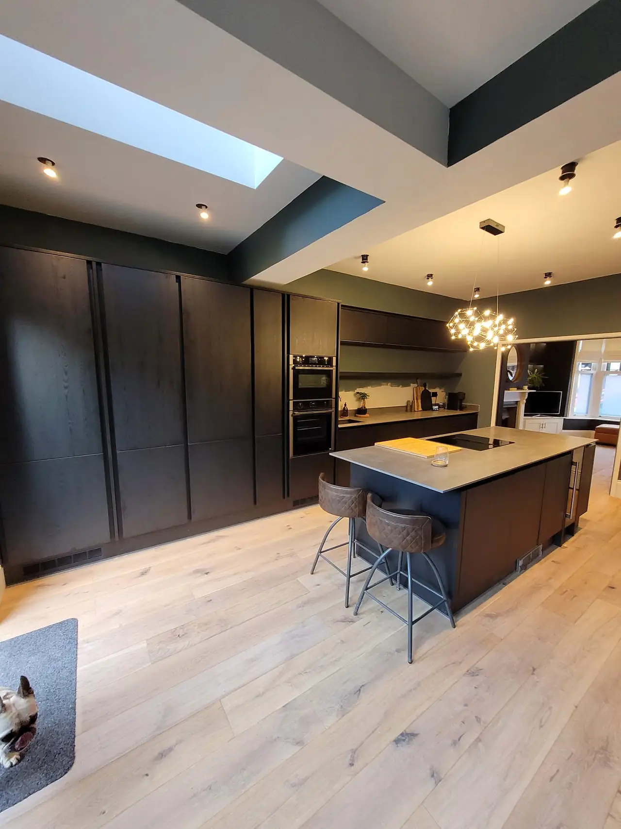 Dark kitchen with oak floor