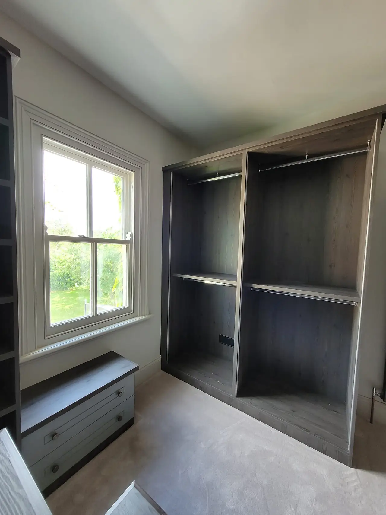 Desk and shelving built around a window