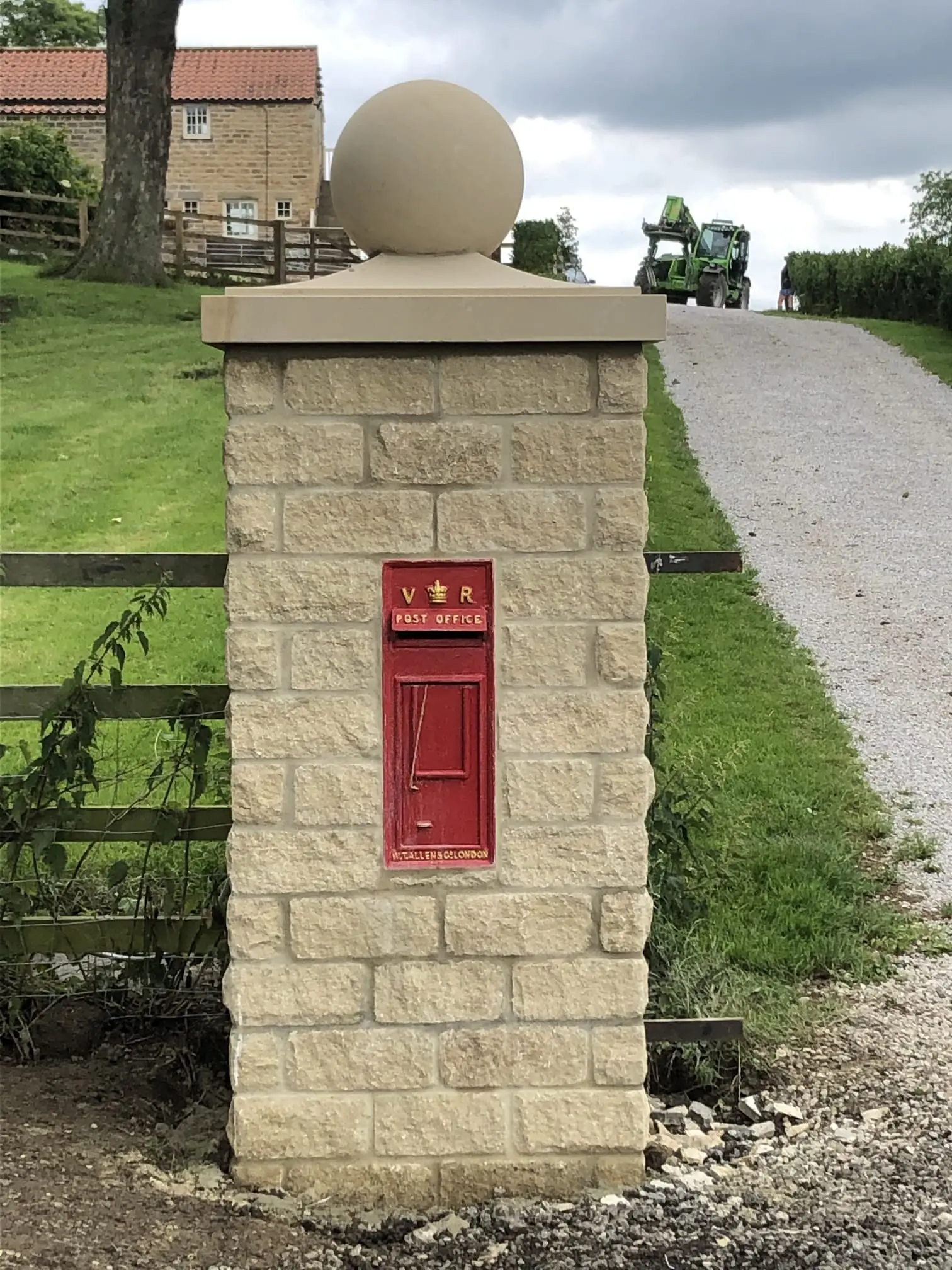 Dressed stone pier with an inset post box