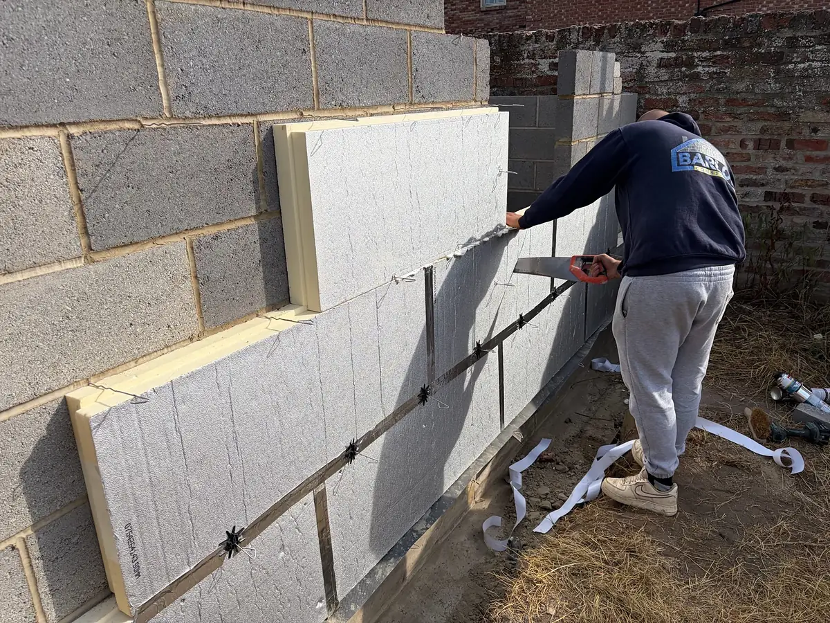 Fixing insulation boards to new blockwork