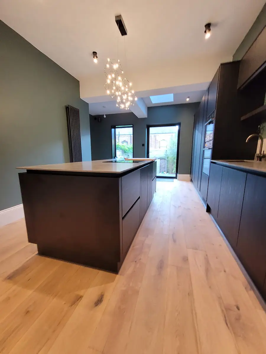 Renovated kitchen with an island and pendant lights