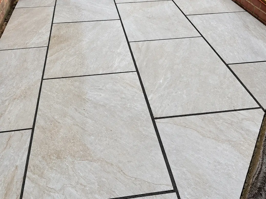 Large format porcelain patio slabs with dark joints