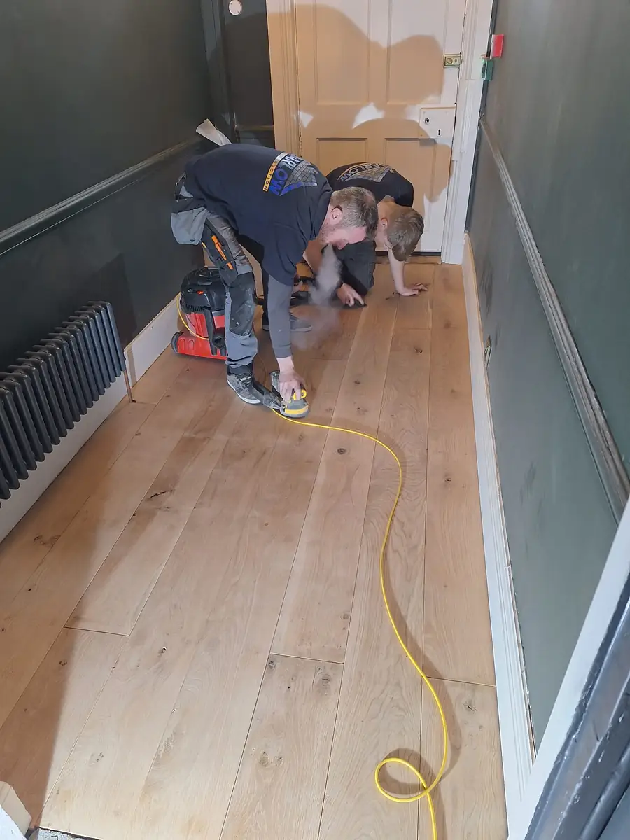 Laying a new timber floor in a hallway