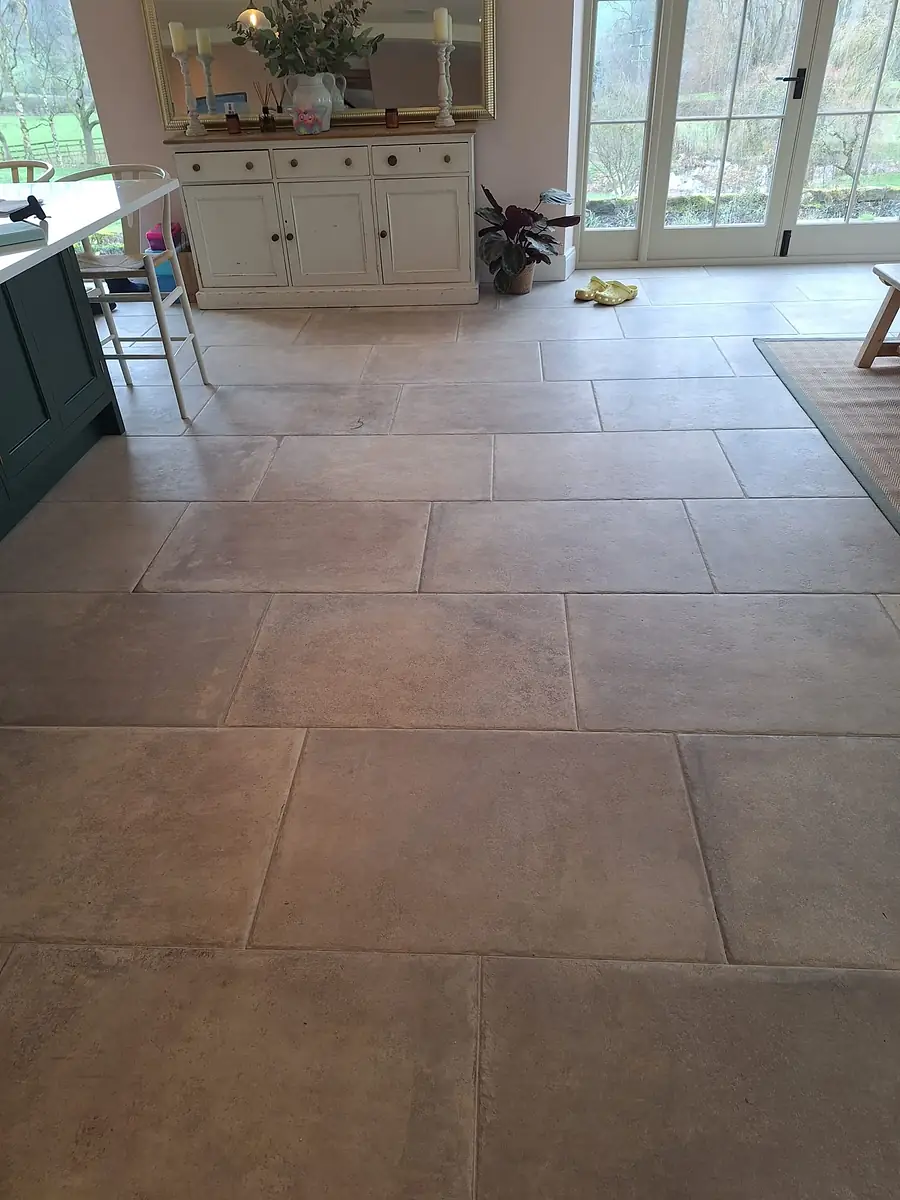 Natural stone floor tiles through a garden room