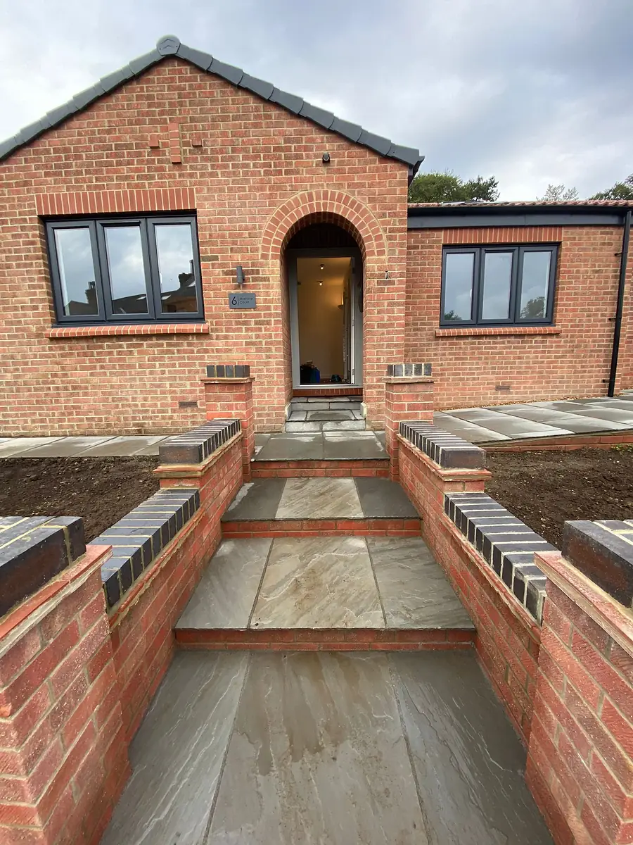 New steps and brick walls at the front door