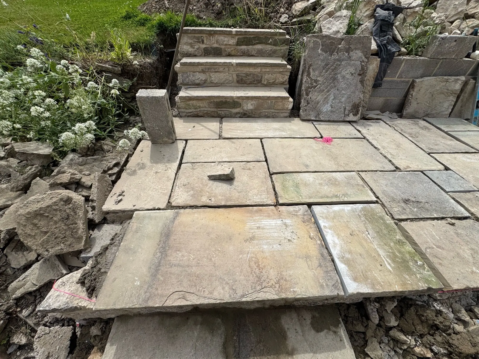 New terrace with stone steps up to the garden