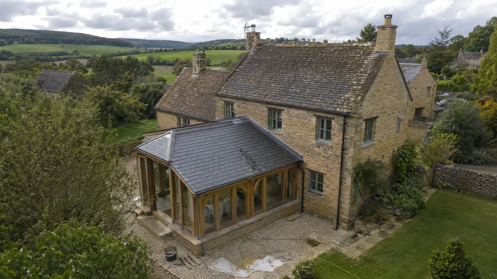 Oak framed orangery on a stone house