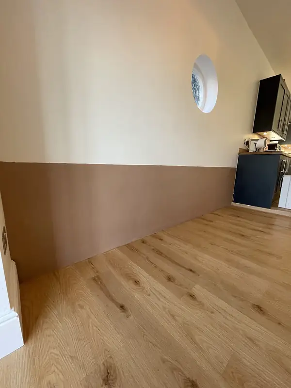Plastered and decorated room with an oak floor