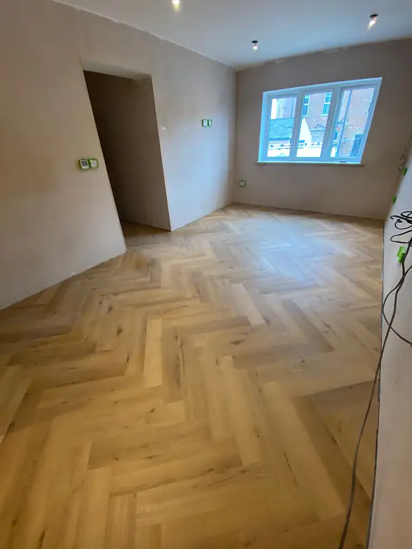 Plastered room with a herringbone floor