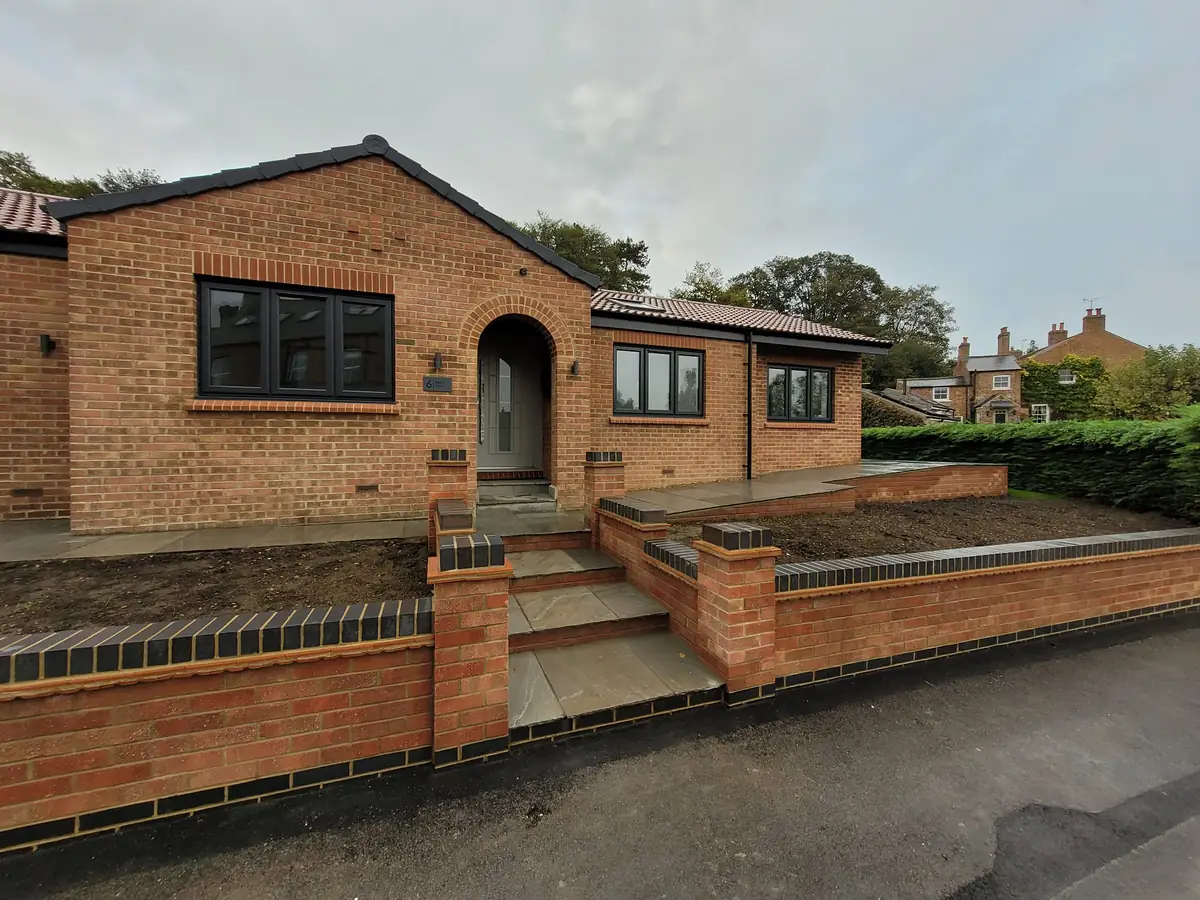 Rebuilt bungalow with new brick walls and steps