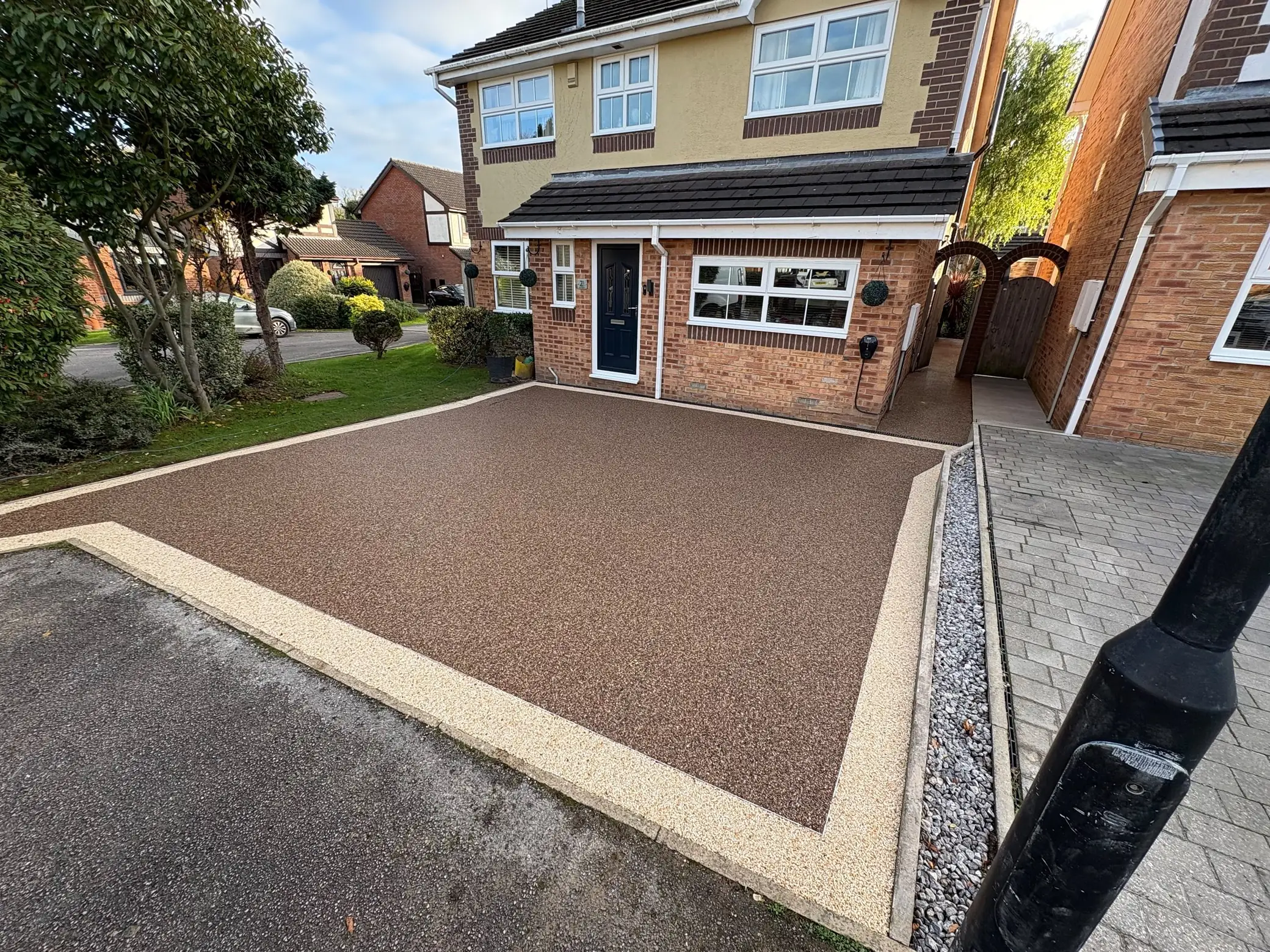 Red resin driveway with light border