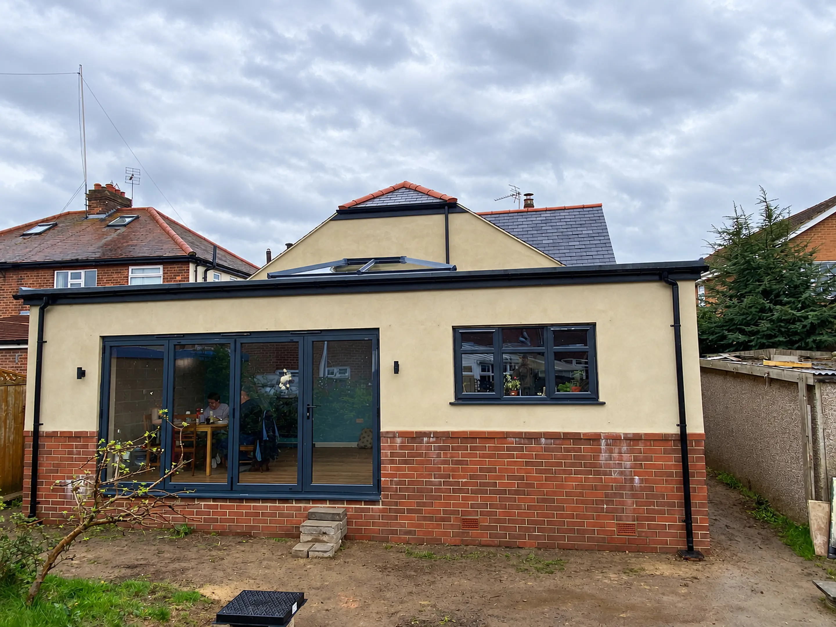 Rendered extension on a family home