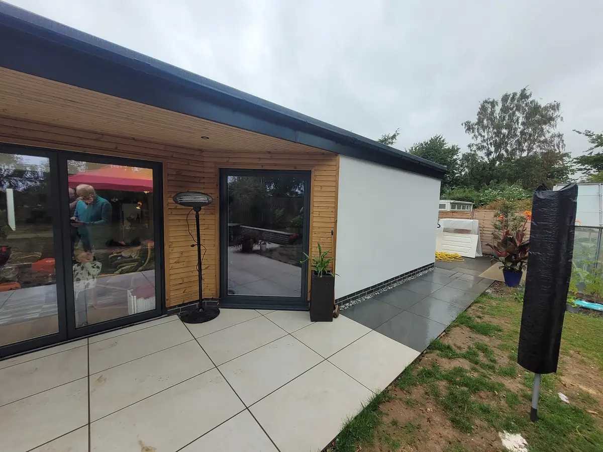 Rendered extension with a porcelain patio