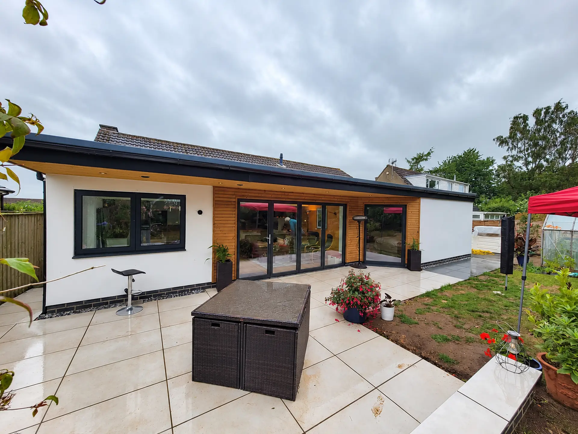 Rendered single storey extension with a large glazed opening
