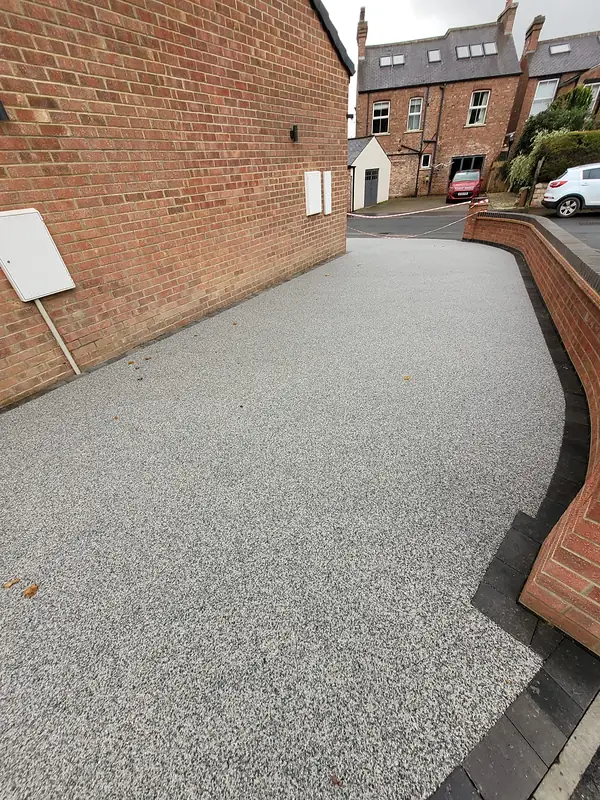 Resin driveway and brick walls at Mallorie Court