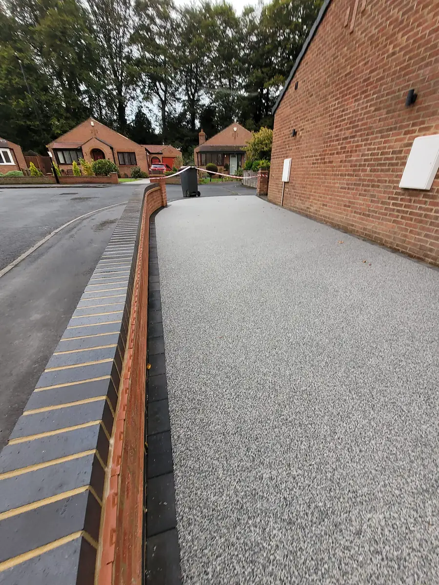 Resin driveway curving to the front door