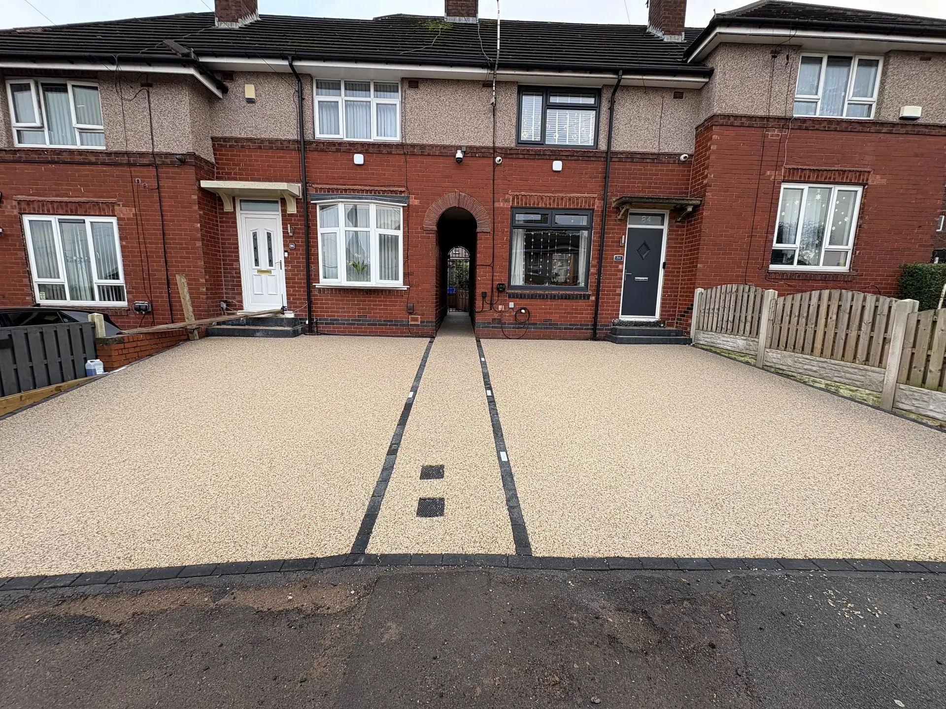 Resin driveway in front of a terrace, laid by our Daltex approved partner