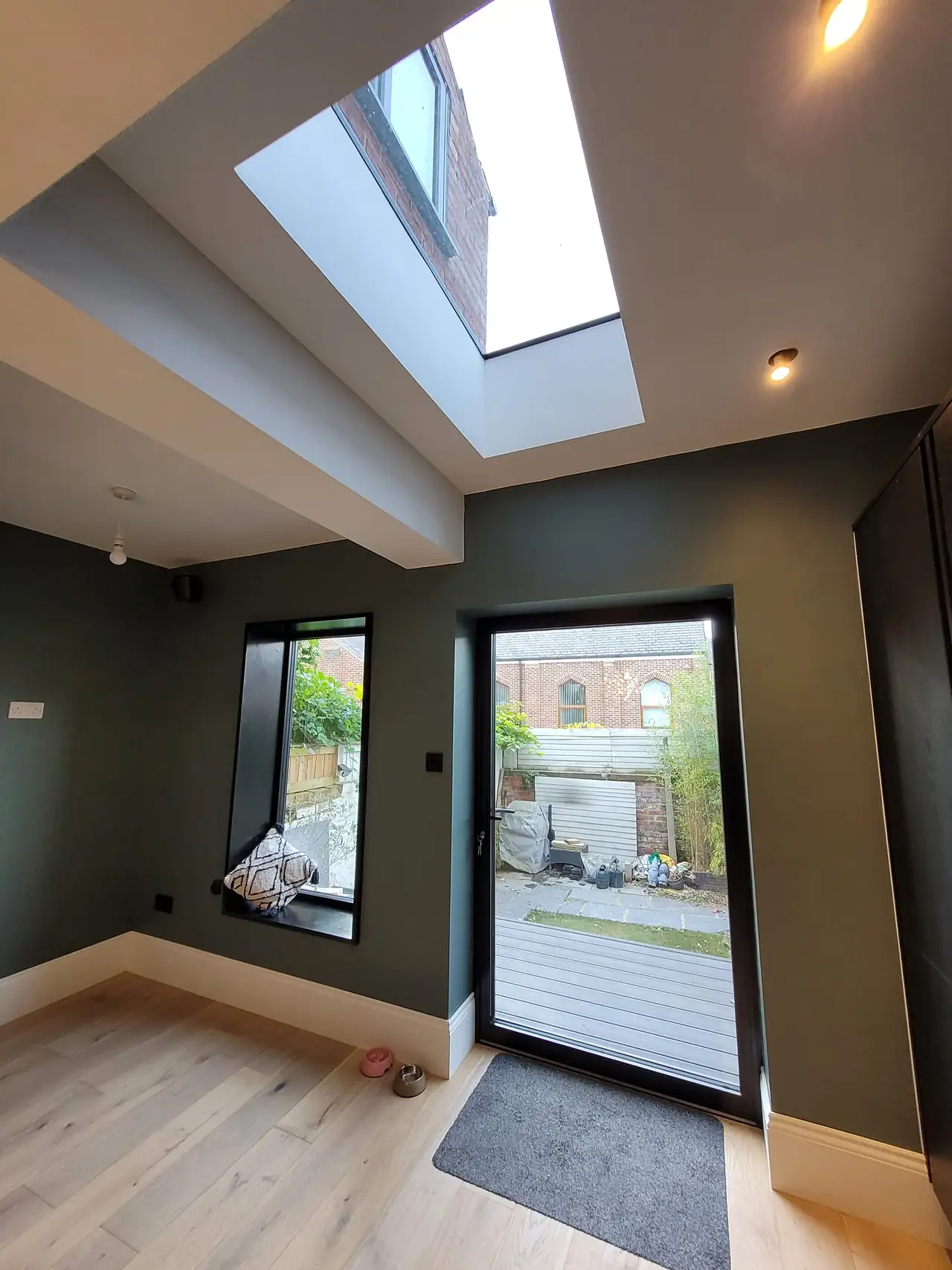 Renovated room with a rooflight and garden door