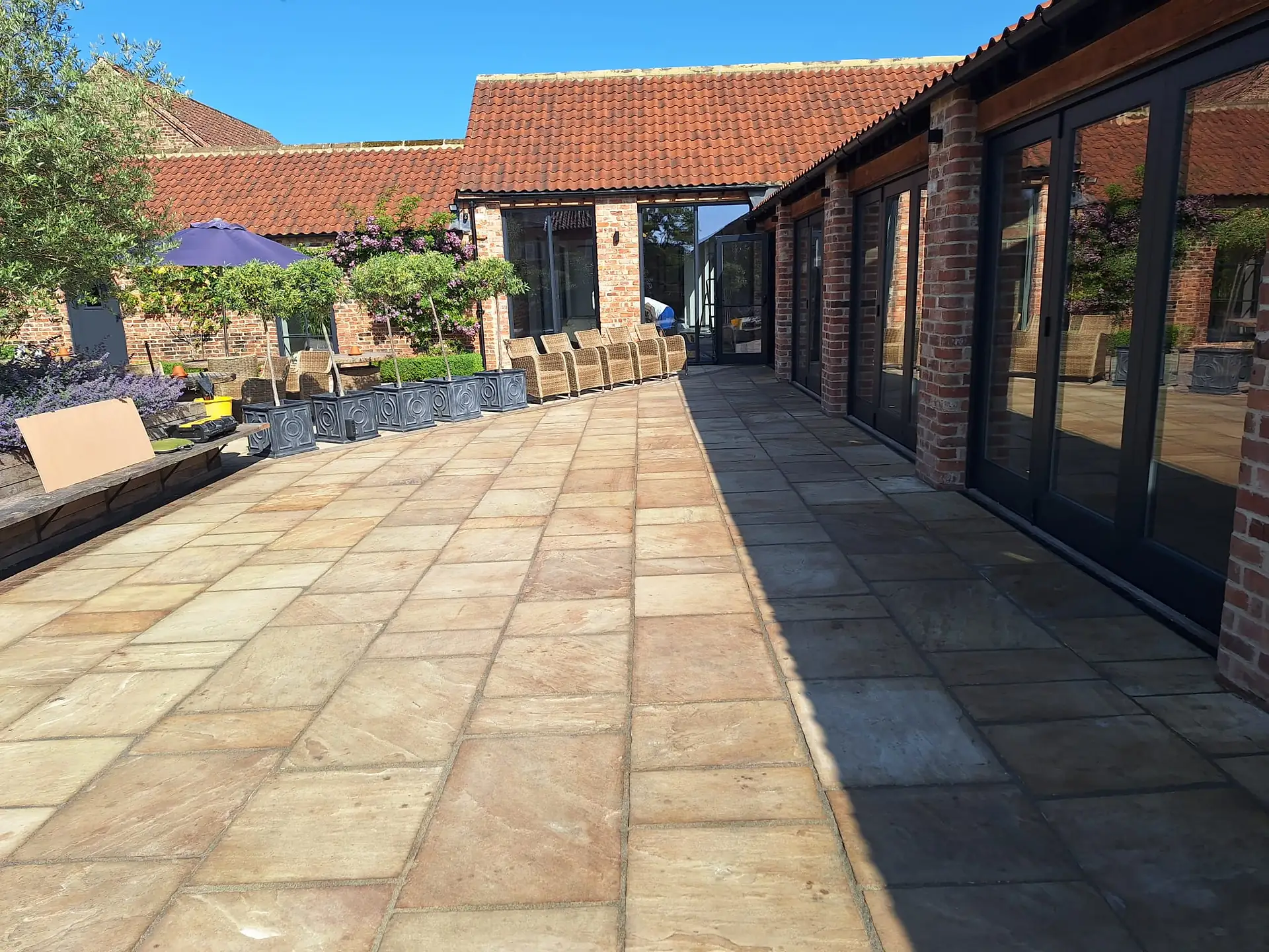 Sandstone courtyard in front of converted barns