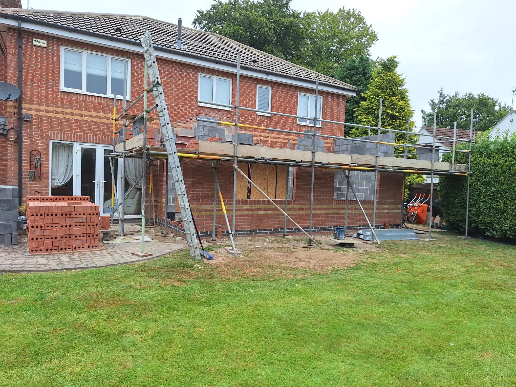 Scaffold and brickwork across the rear