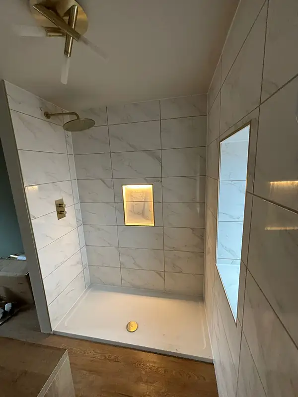 Shower niche in marble effect tiles