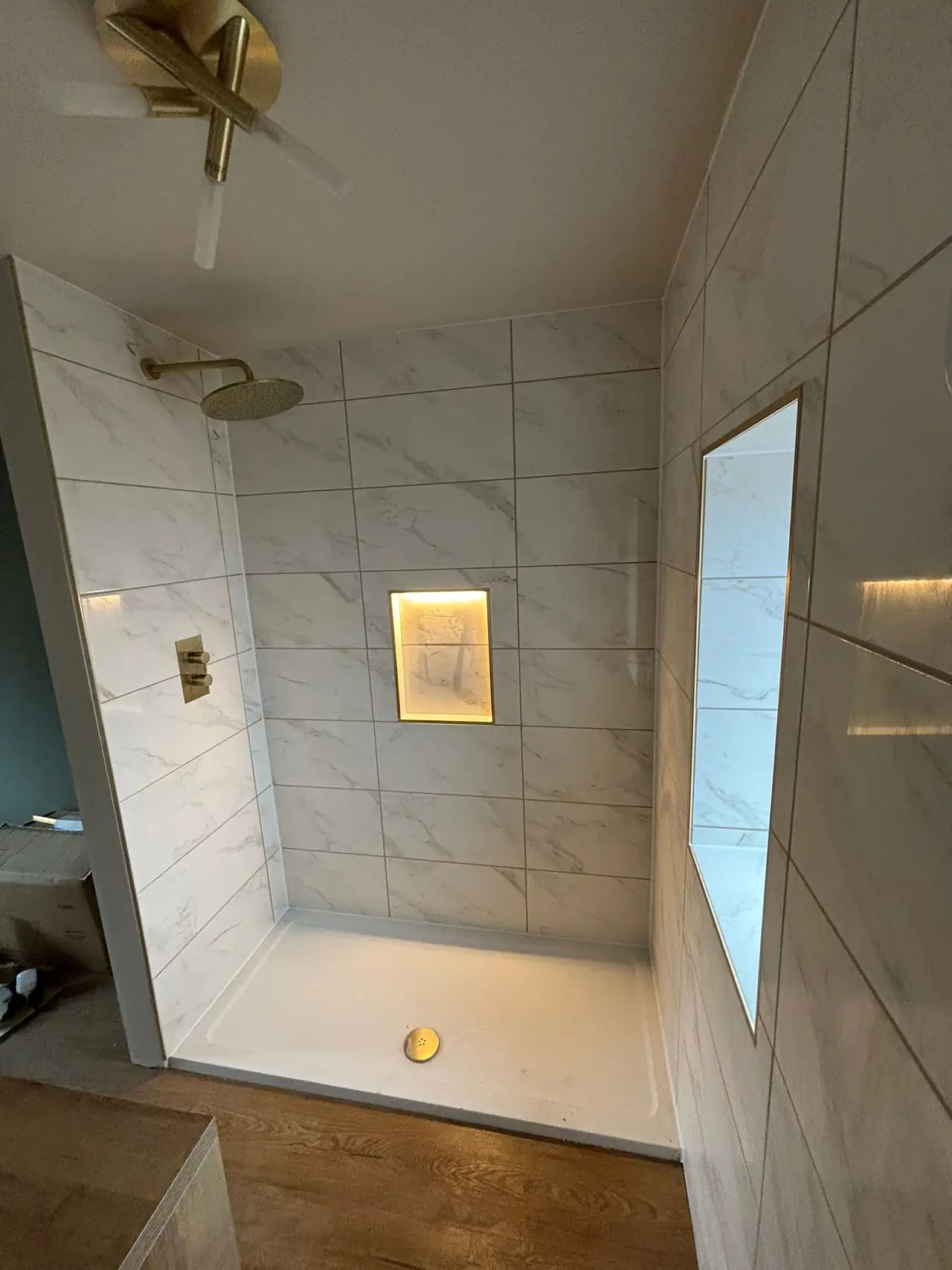 Shower niche in marble effect tiles