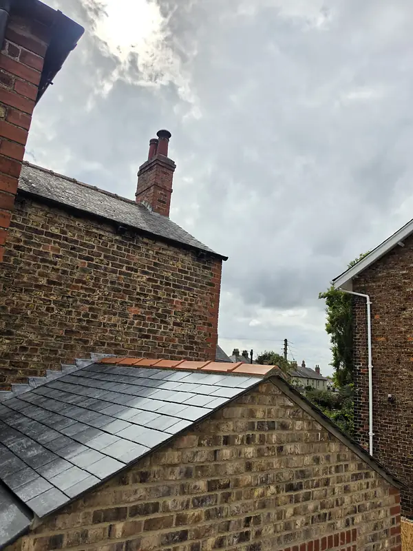 Slate roof and brick chimney on a period house