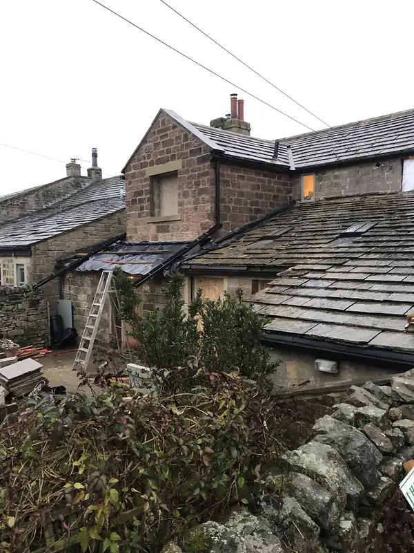 Slate roofs and stone chimneys on period houses