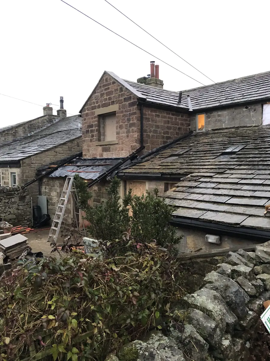 Slate roofs and stone chimneys on period houses