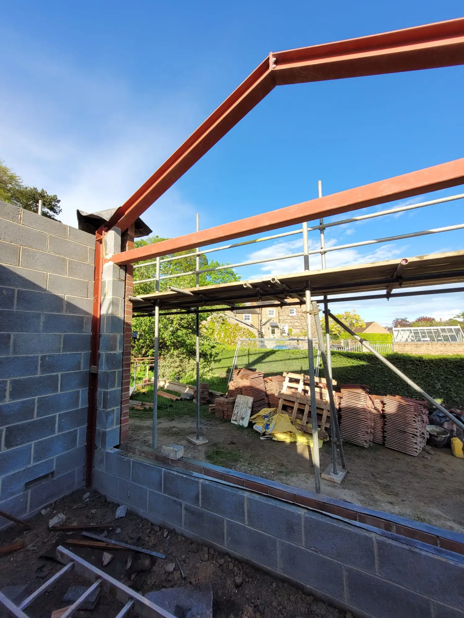 Steel frame going up inside the stripped shell