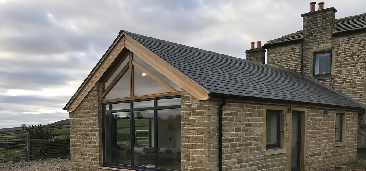 Stone extension with an oak framed glazed gable