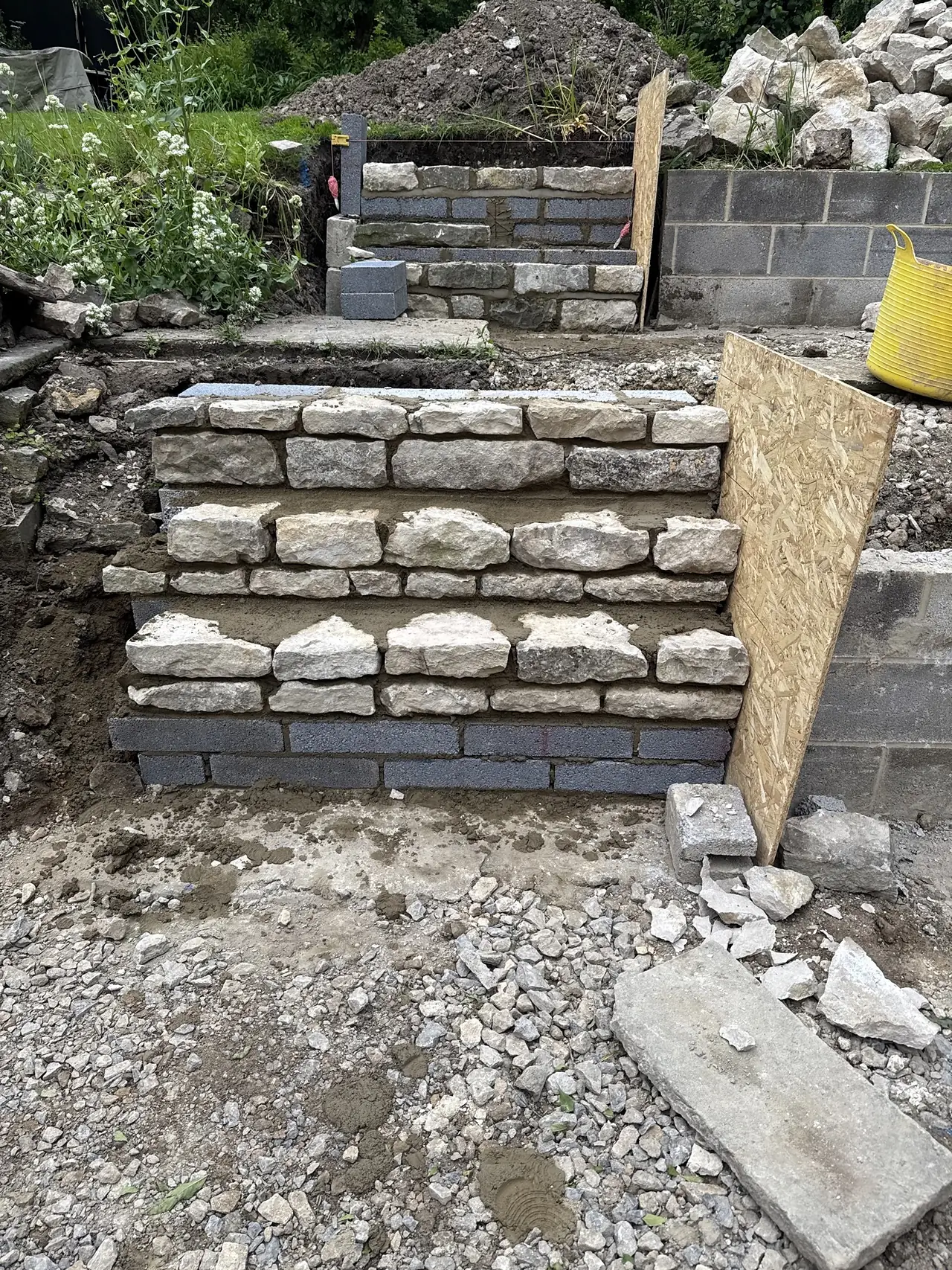 Stone faced retaining wall and steps