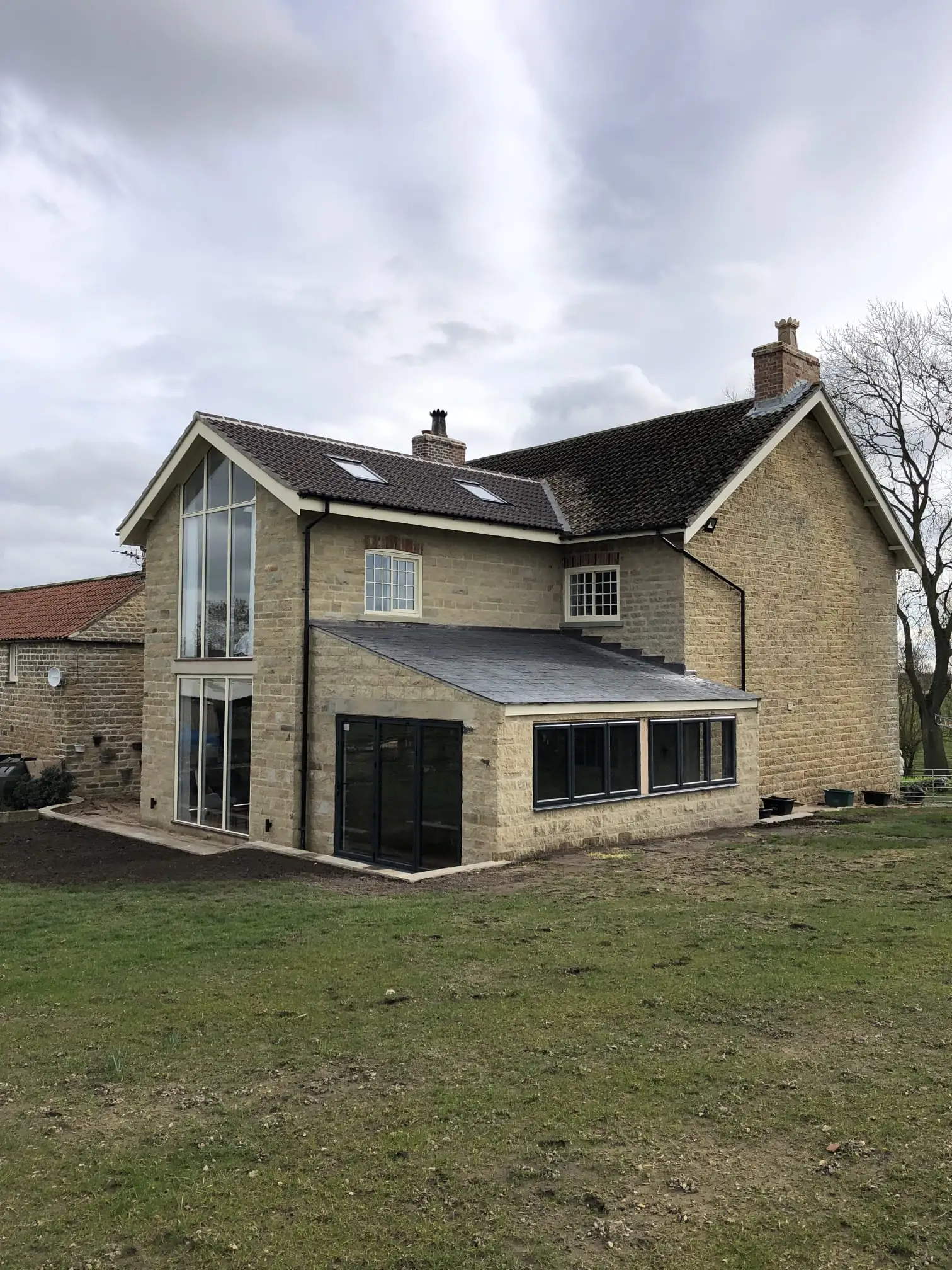 Stone house with a two storey extension