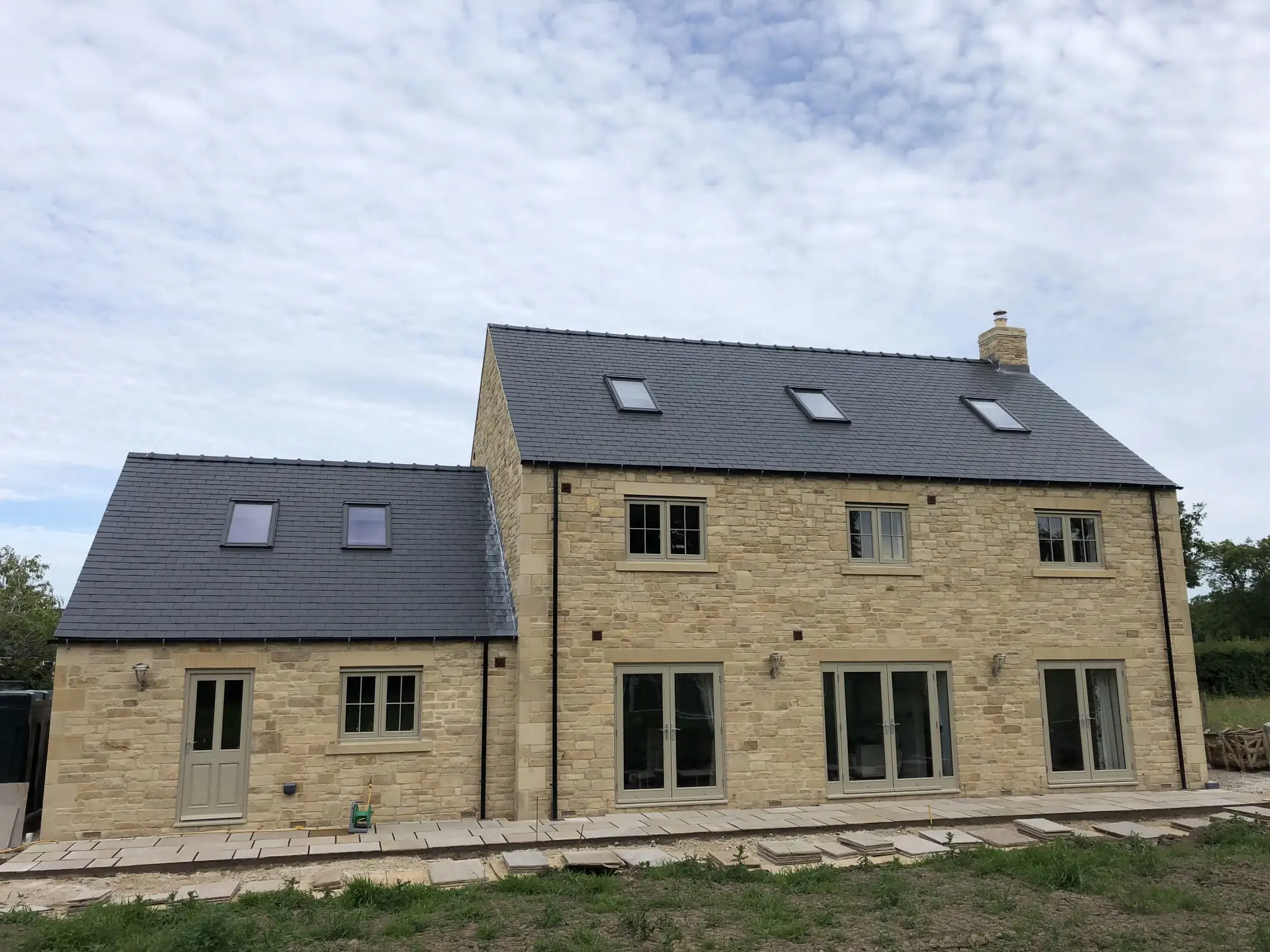 Stone new build house with slate roof