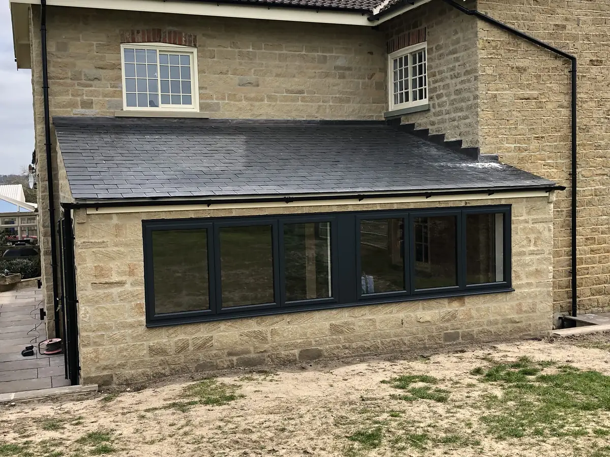 Stone extension with a new slate roof