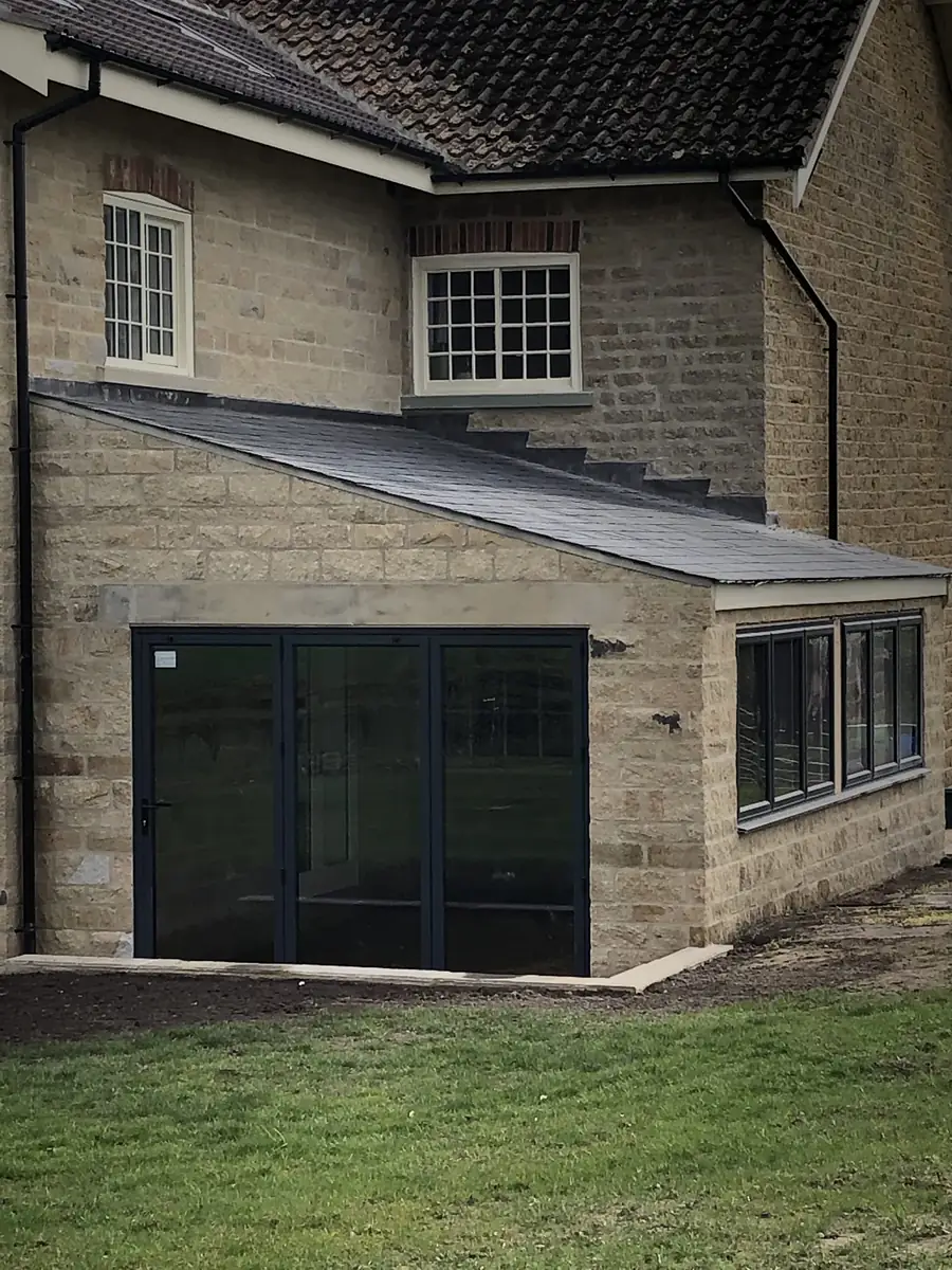 Stone extension with aluminium glazing