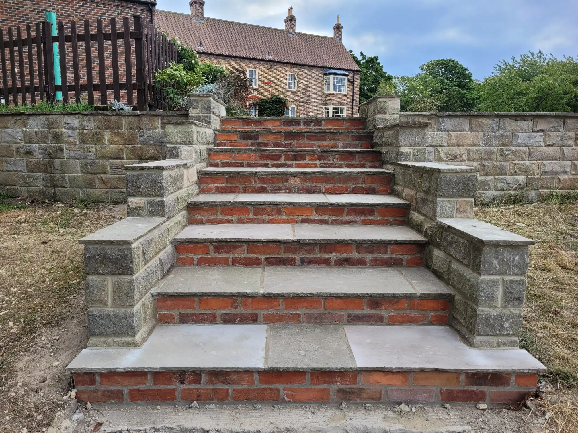 Stone steps with brick risers