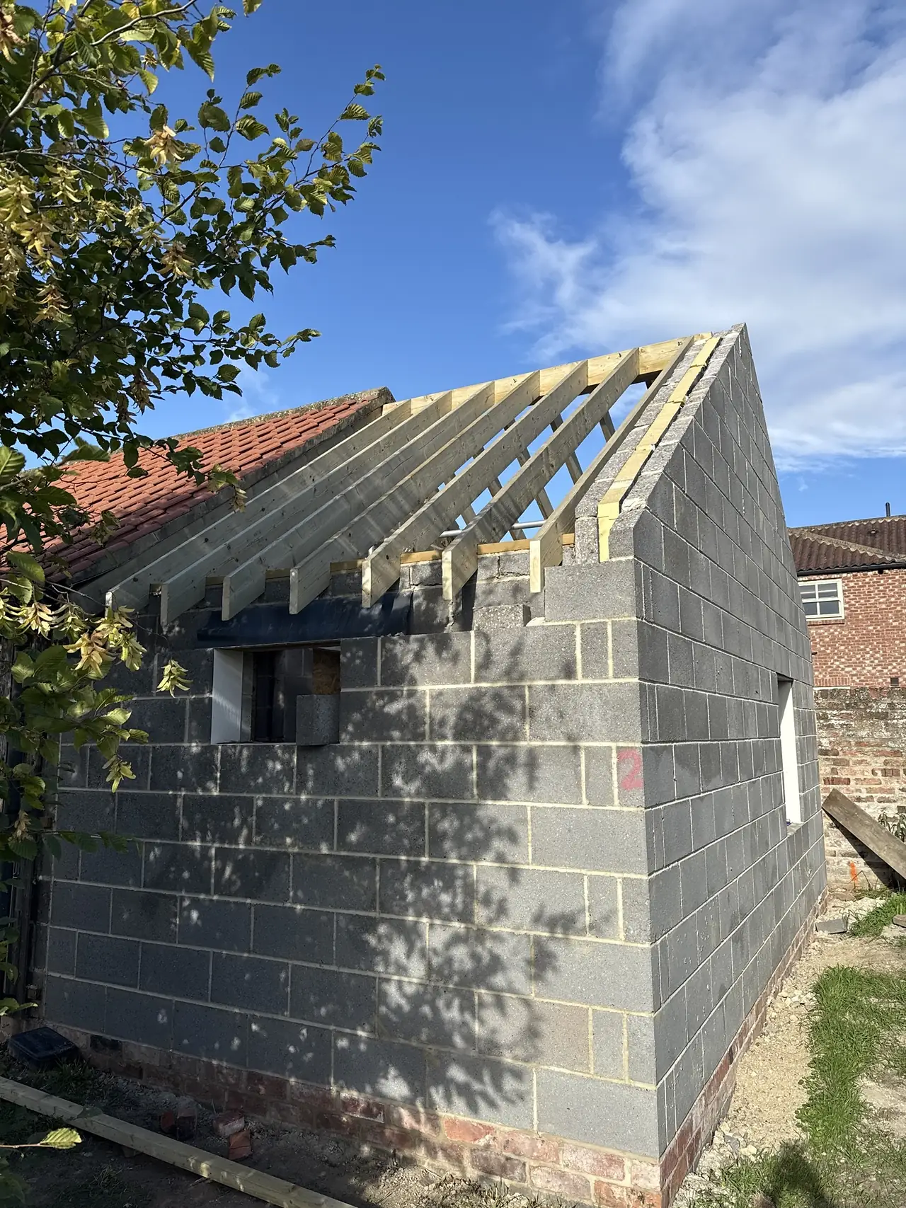 Trusses on the new building from the garden