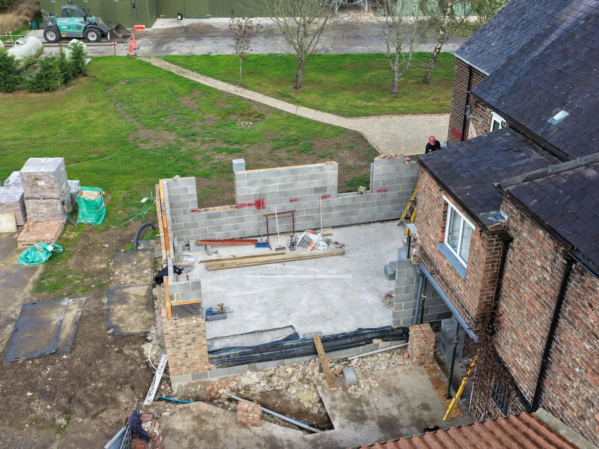 A whole building site from above with the new blockwork up