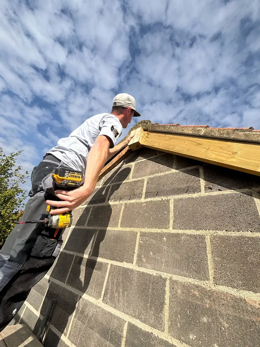 Working along the top of a new gable
